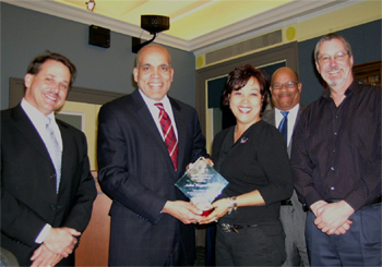 L to R - Dr. Elwood; Dr. Raynard Kington, NIH Deputy Director presenting Appreciation Award to Andrea Wongsam-Nollinger, 2006 Co-Chair, NCCAM; Lawrence Self,  and Steve Cassidy, Budget Officer, NCCAM