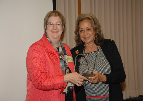 Dr. Joanna Cain receives an award of appreciation for her tenure on the ACRWH from Dr. Vivian W. Pinn