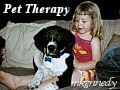 Child visiting with a dog during pet therapy
