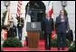 President George W. Bush and Prime Minister Silvio Berlusconi stand together on the reviewing stand Monday, Oct. 13, 2008 on the South Lawn of the White House, during the playing of the National Anthem. White House photo by Chris Greenberg