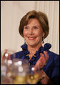 Mrs. Laura Bush applauds Italian Prime Minister Silvio Berlusconi as he his praised in an address by President George W. Bush Monday evening, Oct. 13, 2008, during the White House State Dinner in Berlusconi's honor. White House photo by Joyce N. Boghosian