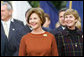 Mrs. Laura Bush and Mrs. Deborah Mullen, wife of the Chairman of the Joint Chiefs of Staff, Admiral Mike Mullen, watch the White House South Lawn ceremonies Oct. 13, 2008, for the State Arrival of Italian Prime Minister Silvio Berlusconi. White House photo by Joyce N. Boghosian