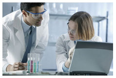 Picture of male and female health care professionals working in a laboratory.