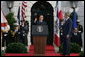 President George W. Bush listens as Prime Minister Silvio Berlusconi addresses his remarks Monday, Oct. 13, 2008, during ceremonies on the South Lawn to welcome Prime Minister Berlusconi to the White House. White House photo by Chris Greenberg