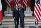 President George W. Bush and Italian Prime Minister Silvio Berlusconi stand together following their remarks at a joint press availability Monday, Oct. 13, 2008, at the White House. President Bush said, "I want to thank you for giving the American People the honor of celebrating Columbus Day with the leader of Italy." White House photo by Chris Greenberg
