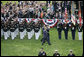 President George W. Bush and Italian Prime Minister Silvio Berlusconi review the troops during welcoming festivities Monday, Oct. 13, 2008, on the South Lawn of the White House. White House photo by Grant Miller