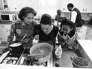 Photo of a family cooking together in the kitchen