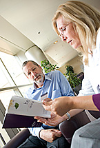 A patient and doctor discuss a booklet.