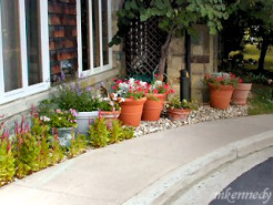 Potted plants and birdfeeders outside the Children's Inn