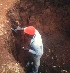Man in a brick pit in Kenya. Brick pits are but one environmental hazard conducive to the formation of mosquito habitats.