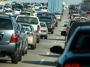 Cars and trucks stuck in traffic on roadway