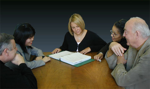 photo of a group of people around a table