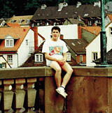 Kelleher sitting on wall in Germany