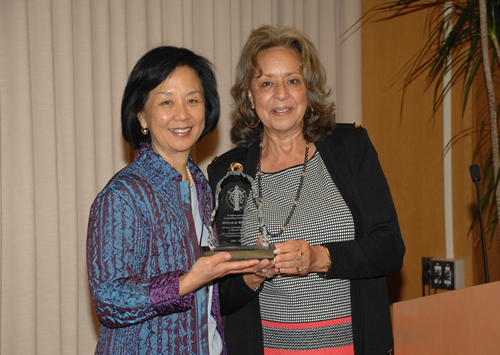 Dr. Phyllis M. Wise (left) receives an award of appreciation for her tenure on the ACRWH from Dr. Vivian W. Pinn
