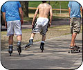 Image of teenagers inline skating and skateboarding