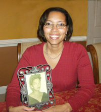 Kelli holds a picture of her grandmother, who inspired her career.