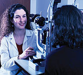 Image of an optometrist performing eye exam