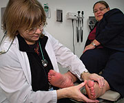 Image of a doctor checking patient's feet