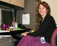 Megan catches up on paperwork at her desk.