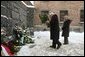 Vice President Dick Cheney, flanked by his daughter Liz Cheney, places a bouquet of flowers at the Wall of Death at the Auschwitz-1 Nazi concentration camp, near Krakow, Poland, Friday, Jan. 28, 2005. Vice President Cheney was there to take part in ceremonies commemorating the 60th Anniversary of the liberation of the Auschwitz camps. The Wall of Death was named for its use as the backdrop for firing squads where thousands of prisoners were executed while the camp was in operation. White House photo by David Bohrer