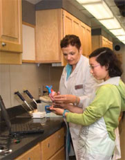 People using lab equipment in a mobile lab