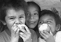 This is a picture of some children eating apples.