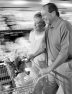 photo of couple pushing grocery cart