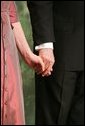 George W. Bush and Laura Bush hold hands during a Black Tie and Boots Ball in Washington, D.C., Jan. 19, 2005. White House photo by Susan Sterner