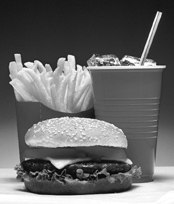 Photo of a hamburger, fries, and soda