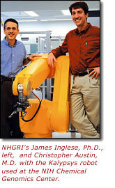 NHGRI's James Inglese, Ph.D., left, and Christopher Austin, M.D. with the Kalypsys robot used at the NIH Chemical Genomics Center.