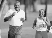 Photo of a couple running together