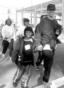 Photo of a boy walking with his mother.