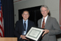 a photo of Dr. Boris Tabakoff accepting an award from NIAAA Director Dr. T.-K. Li