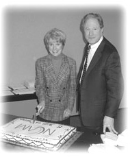 Dr. Straus and Dr. Margaret Chesney cutting cake