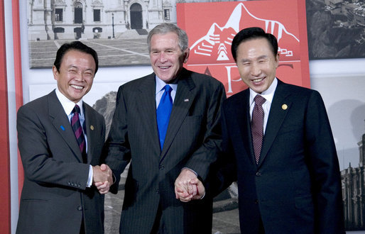 President George W. Bush is flanked by Prime Minister Taro Aso of Japan, left, and President Lee Myung-bak of the Republic of Korea, prior their trilateral meeting Saturday, Nov. 22, 2008, in Lima Peru. White House photo by Eric Draper