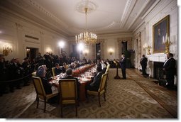 President George W. Bush offers a toast Friday, Nov. 14, 2008, at dinner with Summit on Financial Markets and World Economy participants in the State Dining Room of the White House. "In the State Dining Room tonight are representatives of major industrialized economies, some of the largest developing economies, and key international financial institutions. We are here because we share a concern about the impact of the global financial crisis on the people of our nations. We share a determination to fix the problems that led to this turmoil. We share a conviction that by working together, we can restore the global economy to the path of long-term prosperity." White House photo by Eric Draper