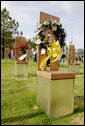 Flowers and personal items are left on several of the 168 memorial chairs at the Oklahoma City National Memorial on the 10th anniversary of the bombing of the Alfred P. Murrah Federal Building in Oklahoma City, Okla. The chairs stand in remembrance of the 168 people who died from the April 19, 1995 terrorist attack. White House photo by David Bohrer