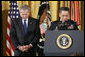 President Bush bows his head as Major General David Hicks, the Army Chief of Chaplains, delivers the invocation Monday, April 4, 2005, during a Medal of Honor ceremony honoring Sgt. 1st Class Paul Smith, killed in action during Operation Iraqi Freedom. White House photo by Eric Draper