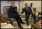 President George W. Bush meets with the Prime Minister Jean-Claude Juncker of Luxembourg in the Oval Office Friday, April 15, 2005. White House photo by Krisanne Johnson