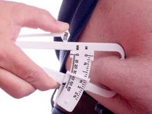 a photo of calipers measuring fat.