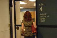 woman 
entering 
door of National 
Institute of Mental Health 
clinic