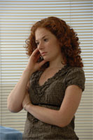 woman in 
front of 
window 
looking 
depressed