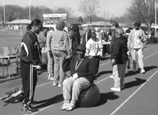 Photo showing Alexandria Sisters Together event at a high school track.