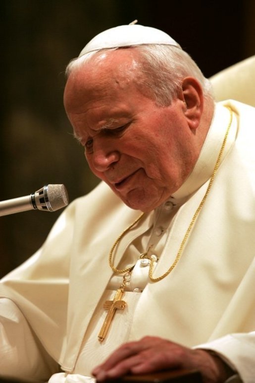 Pope John Paul II speaks after he was honored with the Medal of Freedom in June 2004, presented during his audience with President George W. Bush and Laura Bush. White House photo by Eric Draper