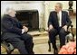 President George W. Bush meets with James Wolfensohn, the outgoing president of the World Bank Thursday, April 14, 2005, in the Oval Office of the White House. White House photo by Paul Morse