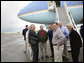 President George W. Bush shares a laugh with his congressional delegation Friday, April 22, 2005, after landing at McGhee Tyson Air National Guard Base in Knoxville. From left are Rep. John Duncan, Jr. (obstructed); Senator Lamar Alexander; Rep. Zach Wamp; Senator Bill Frist; Rep. William Jenkins; EPA Administrator Steve Johnson, and Interior Secretary Gale Norton. White House photo by Eric Draper