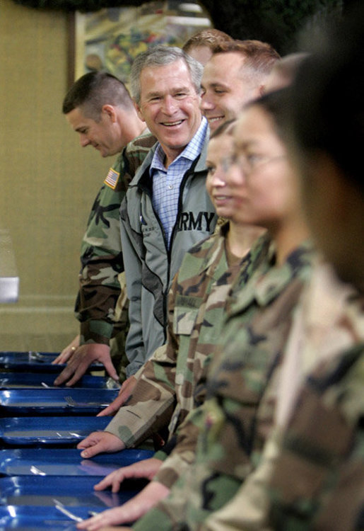 President Bush shares a meal with troops at Fort Hood, Texas Tuesday, April 12, 2005. The two divisions on base are the 1st Cavalry Division and the 4th Infantry Division. There are 44,188 soldiers and airmen stationed at the base and on an average day, there are 25,000 soldiers from Fort Hood serving outside the Continental United States. White House photo by Eric Draper