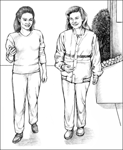 Two women walking briskly for exercise.