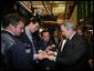 President George W. Bush signs autographs Wednesday, Jan. 31, 2007, during a surprise visit to the New York Stock Exchange. The visit marked only the second time a sitting president has visited the floor during regular Exchange hours. White House photo by Paul Morse