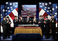 Vice President Dick Cheney, second left, is joined by government officials and family members of former President Gerald R. Ford in applause during a naming ceremony for the new U.S. Navy aircraft carrier, USS Gerald R. Ford, at the Pentagon in Washington, D.C., Tuesday, Jan. 16, 2007. The nuclear-powered aircraft carrier will be the first in the new Gerald R. Ford class of aircraft carriers in the U.S. Navy. Pictured from left to right are Secretary of the Navy Donald Winter, Vice President Dick Cheney, Susan Ford Bales, Steve Ford, Jack Ford, Michael Ford, Senator John Warner, R-Va., Senator Carl Levin D-Mich., and Chief of Naval Operations, Admiral Mike Mullen. White House photo by Paul Morse